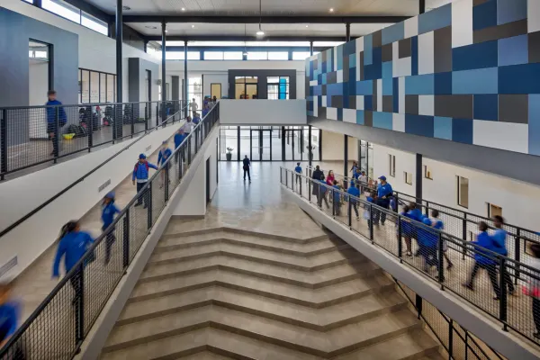 Waterford International, a double-volume corridor with students on the stairs